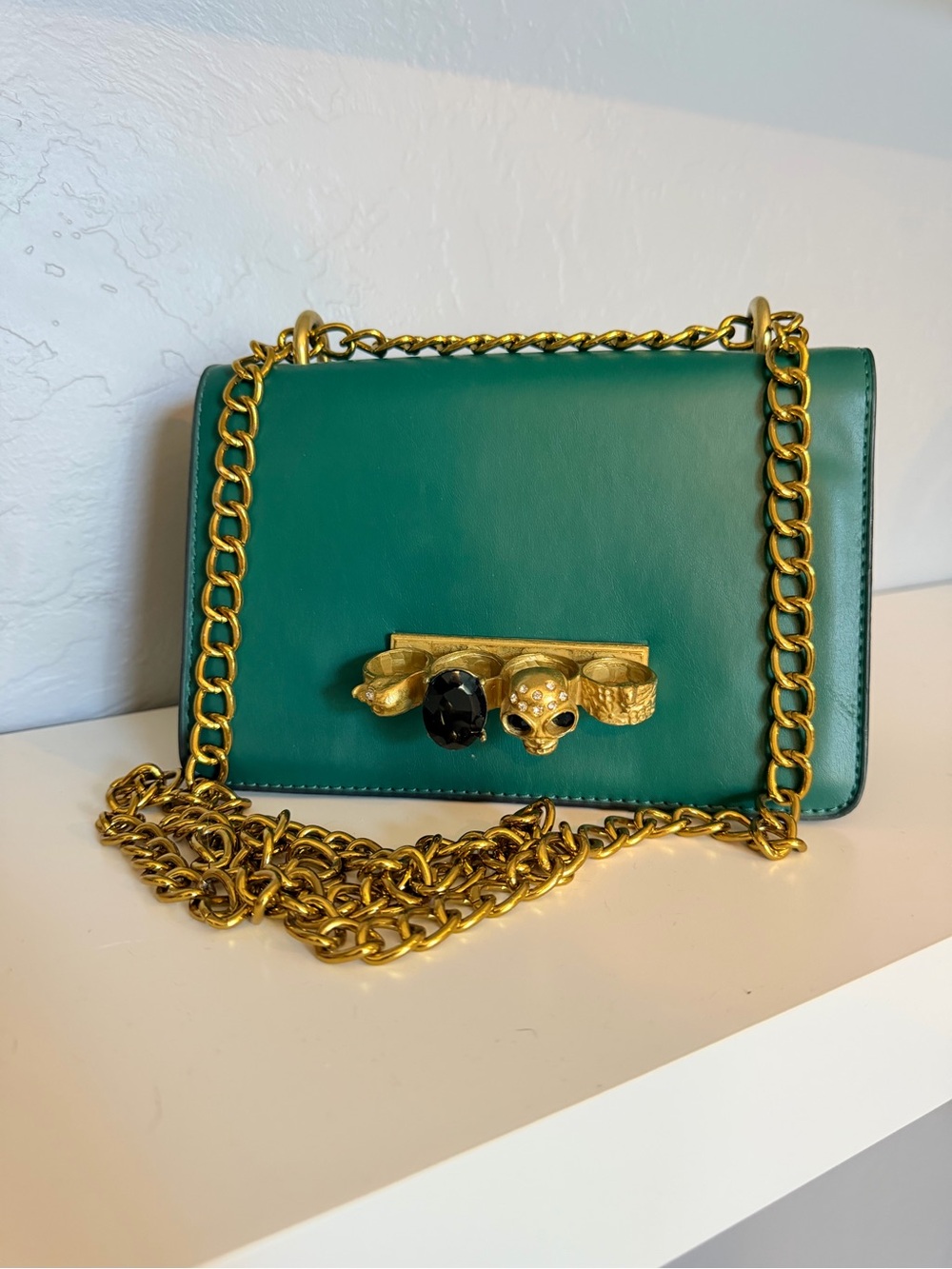 Emerald Leather Crossbody Bag with Gold Chain and Skull Accent